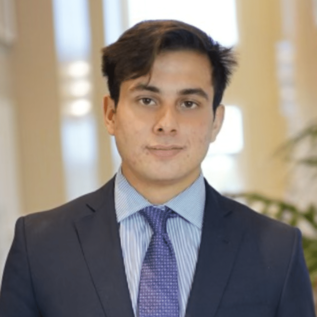 Headshot of John Giambalvo.