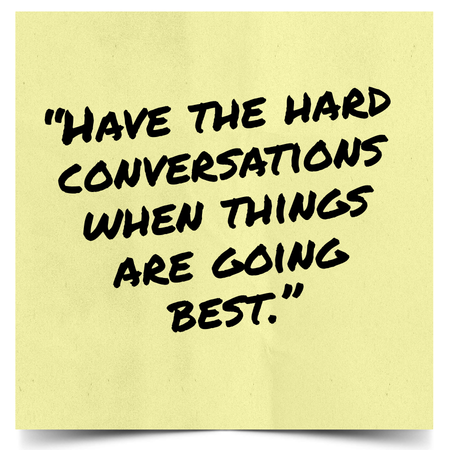 Yellow sticky note with bold black handwriting reading: “Have the hard conversations when things are going best.”